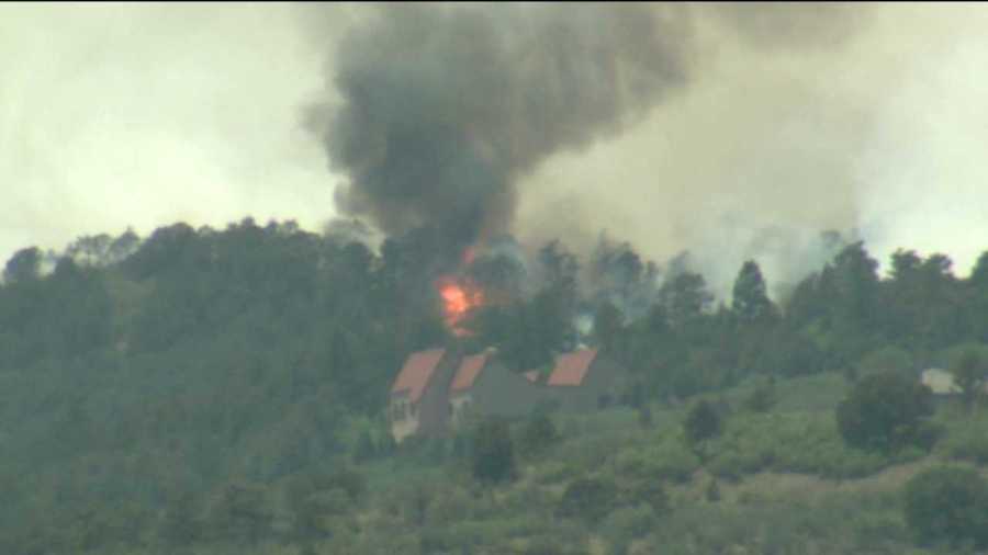 Flames threaten a home in the Waldo Canyon Fire in El Paso County, Colo. June 25, 2012