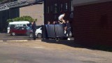 Aurora theater shooting, July 20, 2012 -- Police dig bullet casings out of the trash behind the suspect's apartment