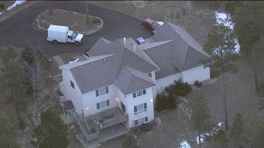 Police investigate outside the home of Colorado Department of Corrections Executive Director Tom Clements, who was shot and killed answering his door on March 19, 2013.