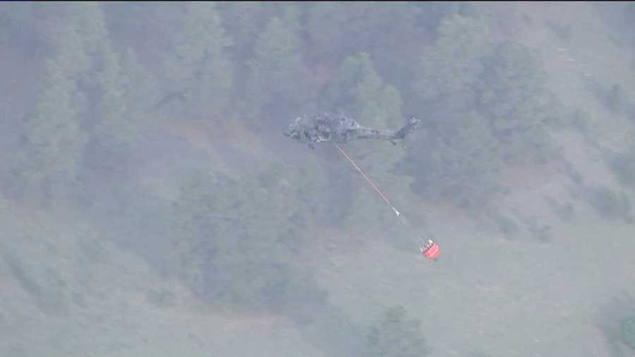 An emergency helicopter surveys the scene over the Black Forest Fire on June 13, 2013.