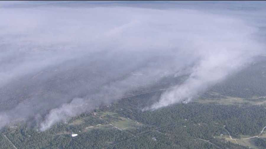 Smoke billows from the Black Forest Fire as it spreads to 15,000 acres on June 13, 2013.