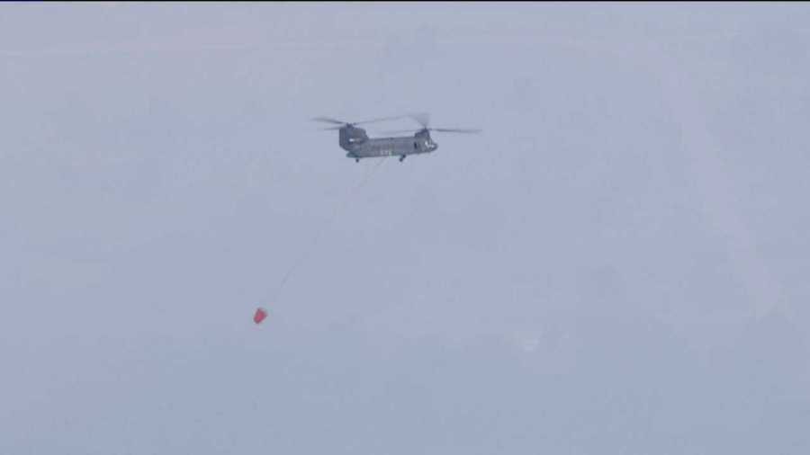 An emergency helicopter surveys the scene over the Black Forest Fire on June 13, 2013.