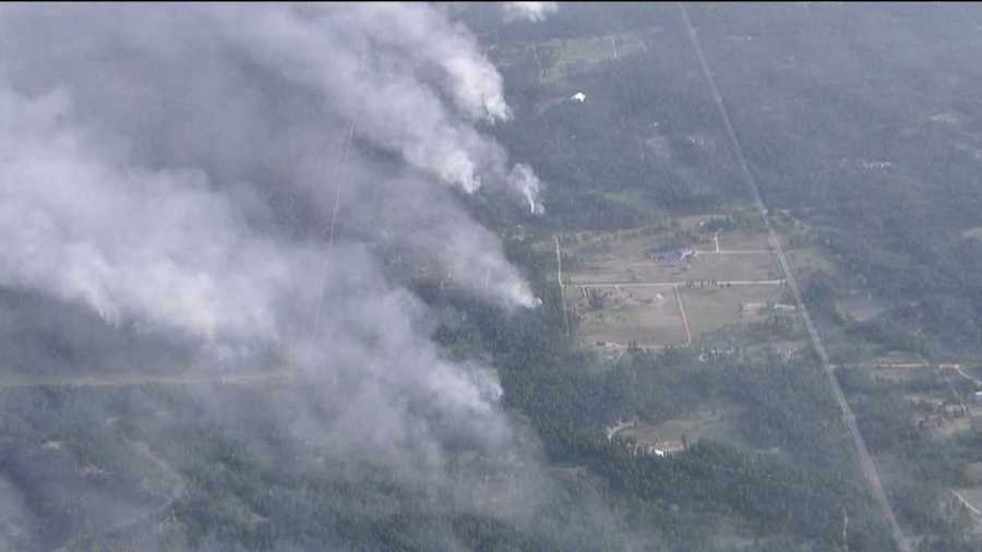 Smoke billows from the Black Forest Fire as it spreads to 15,000 acres on June 13, 2013.