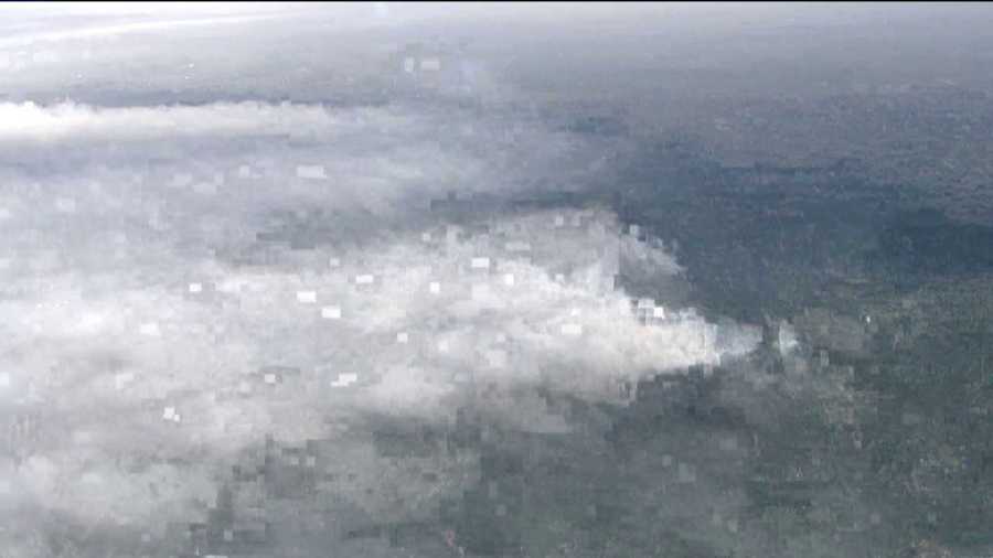 Smoke billows from the Black Forest Fire as it spreads to 15,000 acres on June 13, 2013.