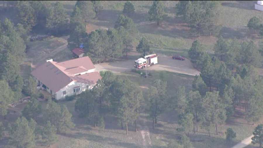 Emergency crews service a home in the middle of the Black Forest Fire on June 13, 2013.