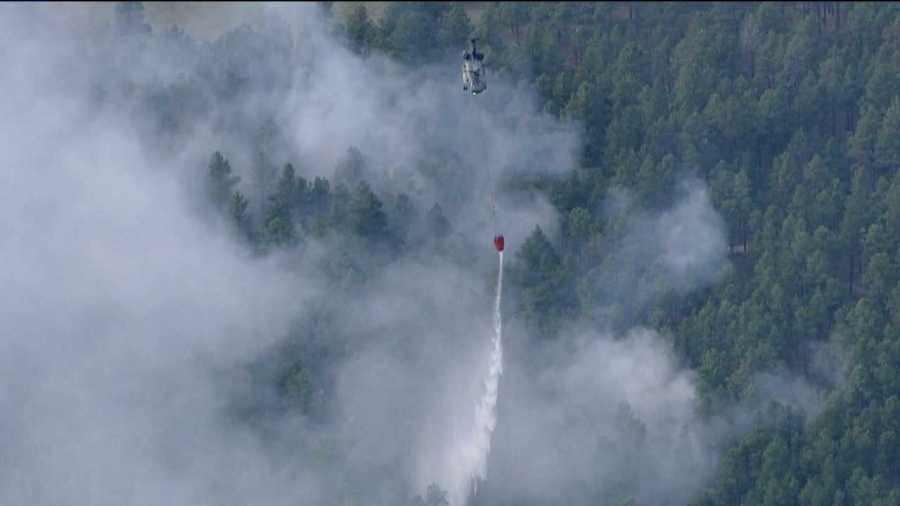 A helicopter makes a dump on the Black Forest Fire on June 13, 2013.