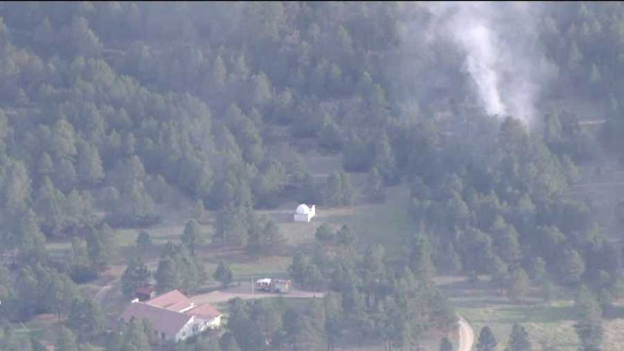 The Black Forest fire bears down on a home on June 13, 2013.