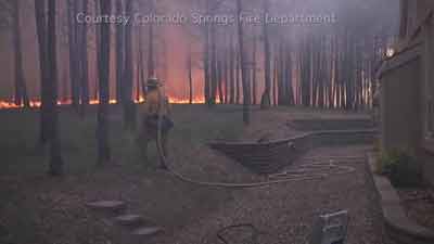 Firefighters save home from Black Forest willdfire. Photo: Colorado Springs Fire Department