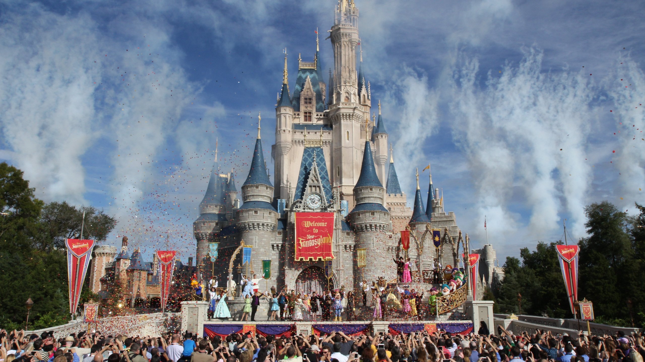 Disney World patrons watch the grand opening ceremony of the new Fantasyland expansion on December 6, 2012. (Credit: CNN)