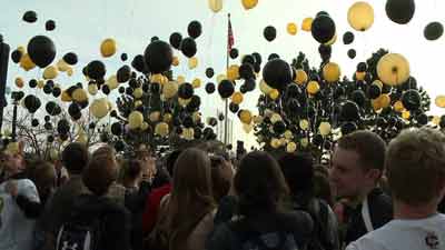 Cherry Creek H.S. students release balloons to support Arapahoe H.S. and Claire Davis