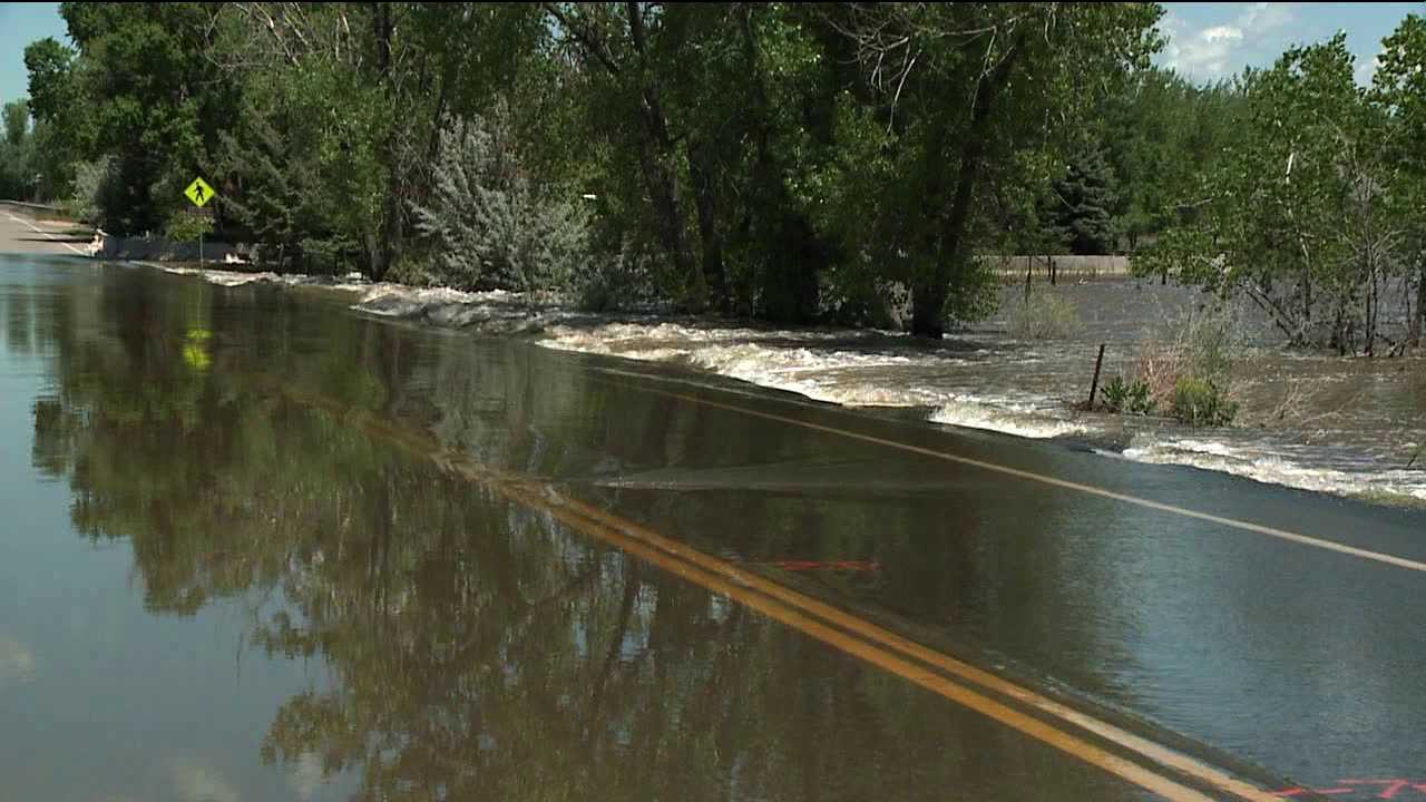 River floods a road in Greeley, Colo.