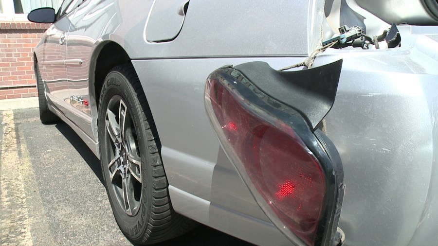 Parked car damaged in collision at 12th and Grant in Denver