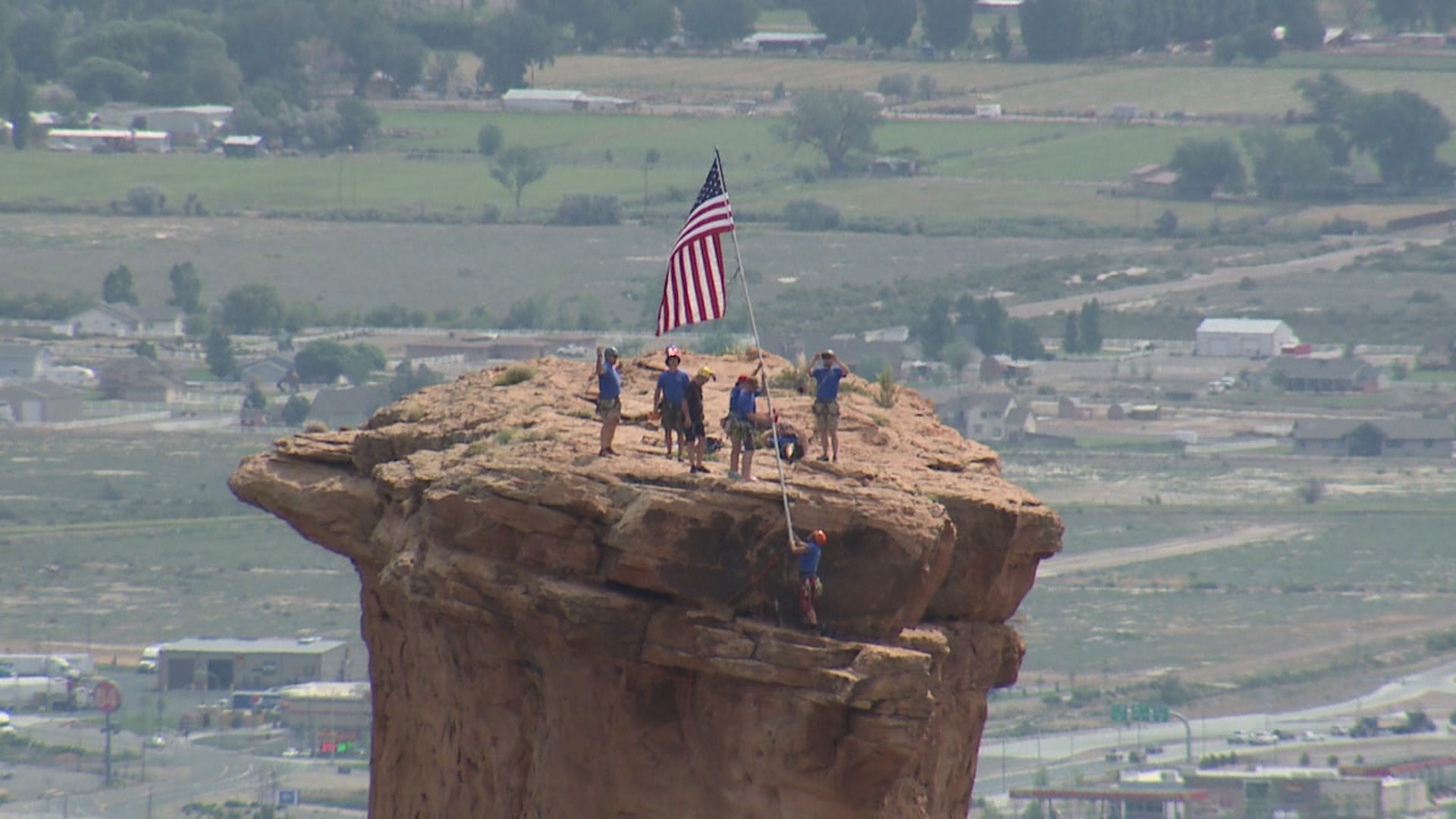 Raising Old Glory on Independence Monument