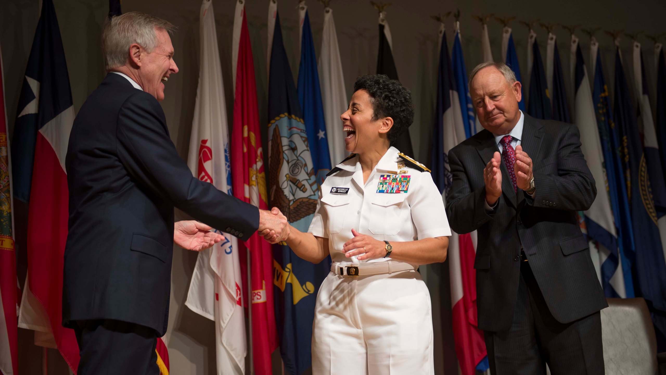 Secretary of the Navy Ray Mabus congratulates Adm. Michelle Howard after putting on her fourth star during her promotion ceremony at the Women in Military Service for America Memorial. Photo: Peter D. Lawlor/U.S. Navy