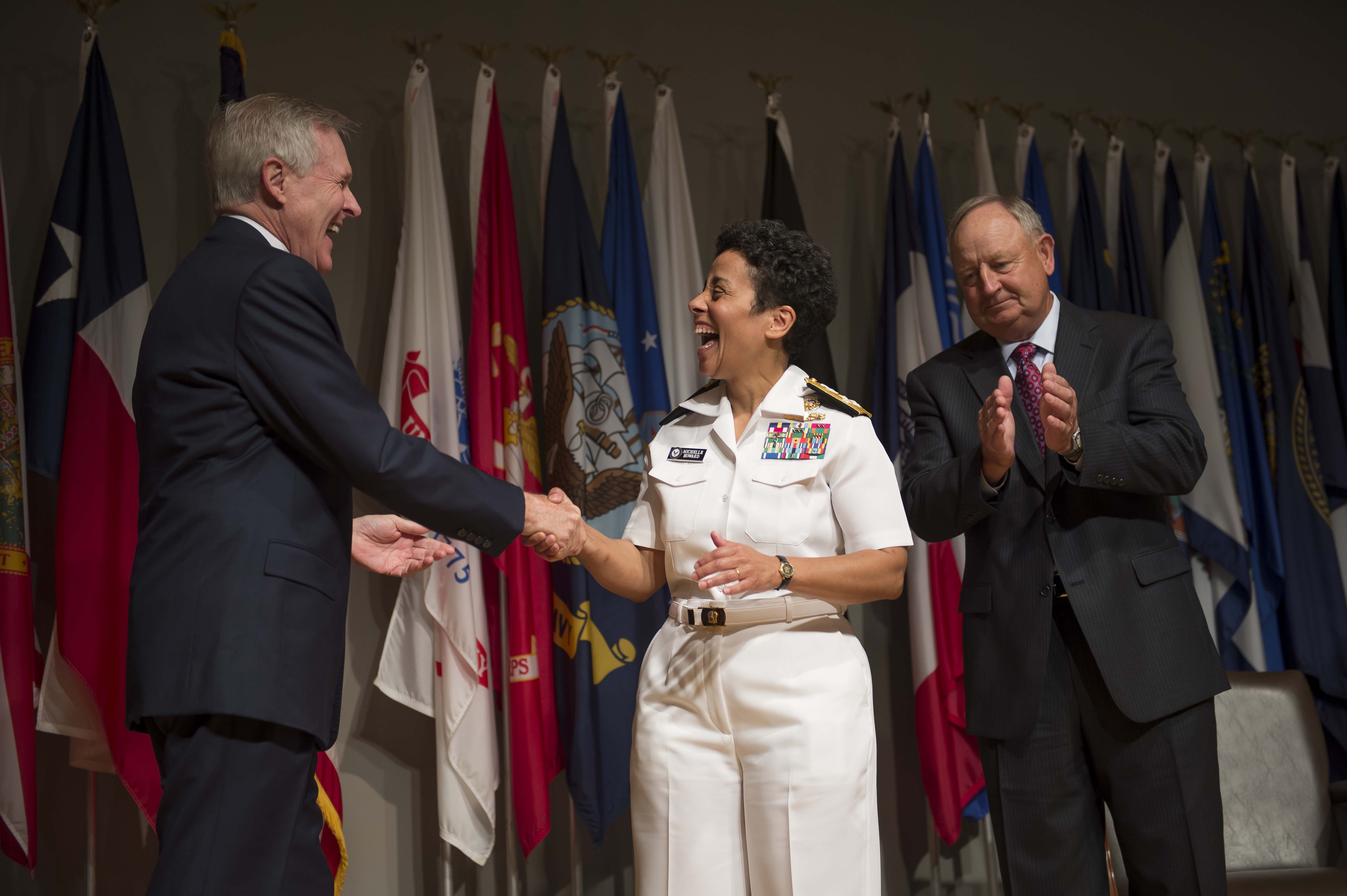 Secretary of the Navy Ray Mabus congratulates Adm. Michelle Howard after putting on her fourth star during her promotion ceremony at the Women in Military Service for America Memorial. Photo: Peter D. Lawlor/U.S. Navy