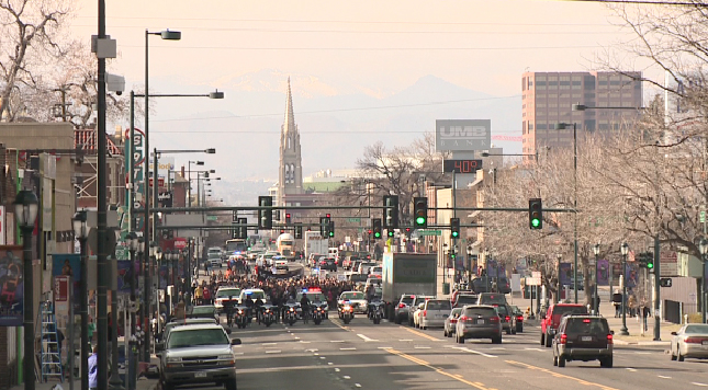 Students walked down Colfax Avenue headed back to East High School