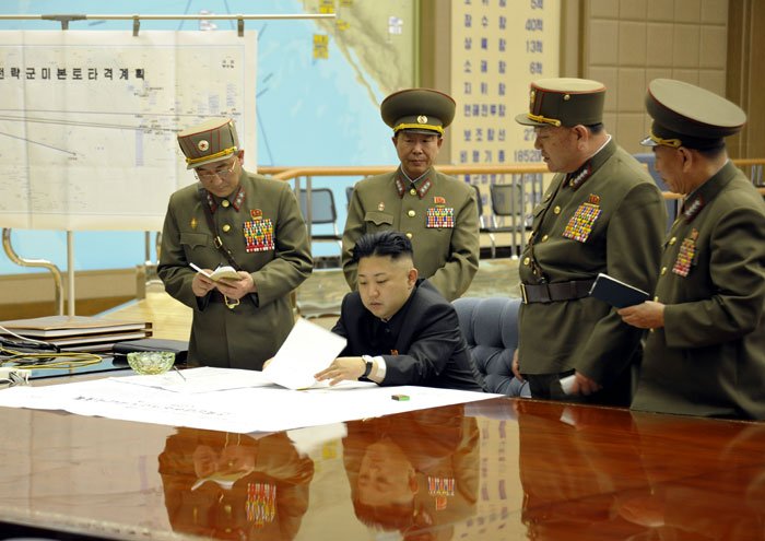 Kim Jong Un is briefed by his generals on March 29, 2013.