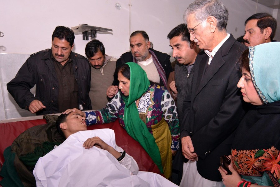 Pakistani officials check on the health of injured children at LRH Peshawar. Photo: Pakistan government