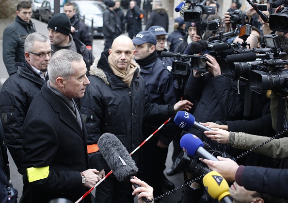 Christian Flaesch (L), director of the Paris' judiciary police talks to the press after he arrived at the headquarters of the French satirical newspaper Charlie Hebdo in Paris on January 7, 2015, after armed gunmen stormed the offices leaving eleven dead, including two police officers, according to sources close to the investigation. (Photo: KENZO TRIBOUILLARD/AFP/Getty Images)