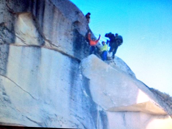 Tommy Caldwell and Kevin Jorgeson reach the summit of a 3,000-foot tall rock formation called El Capitan in Yosemite National Park in California.