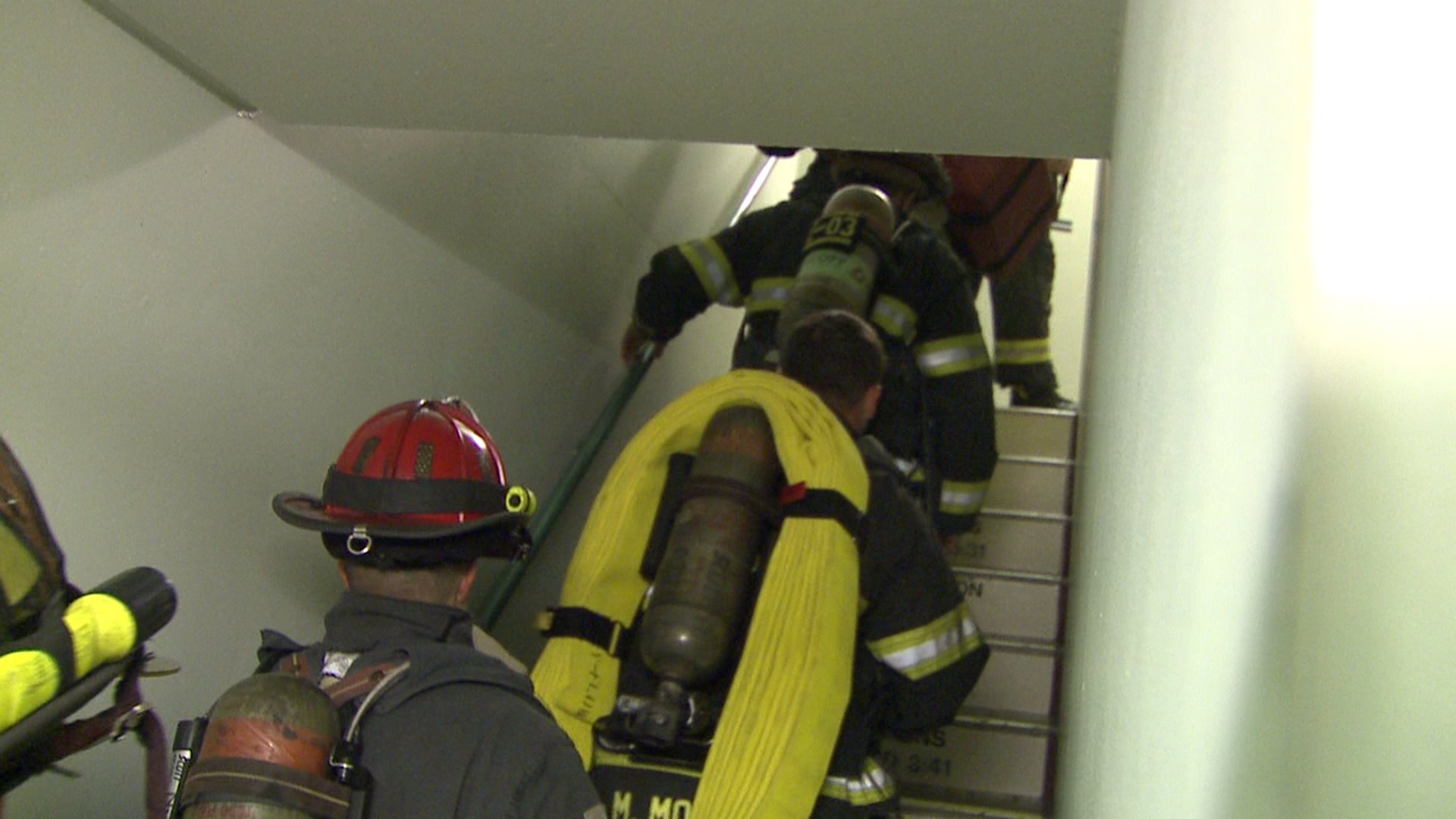 Firefighter recruits climb to top of Denver skyscraper as part of their training