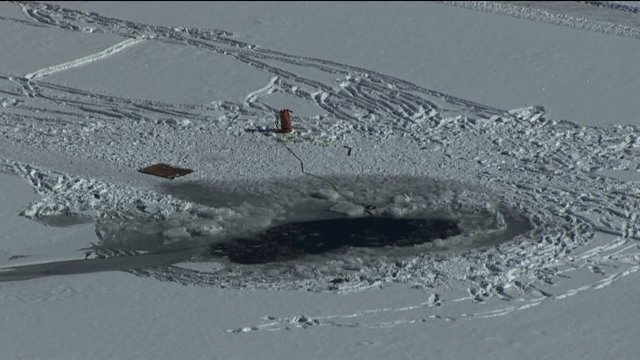 Hole in the ice at Evergreen Lake