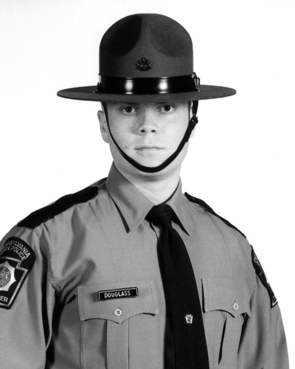 Two Pennsylvania State Police troopers were shot late Friday, Sept. 12, 2014 outside the police barracks in Blooming Grove, Pennsylvania. Cpl. Bryon K. Dickson was killed and Trooper Alex T. Douglass (shown) was in stable but critical condition on Sunday evening.