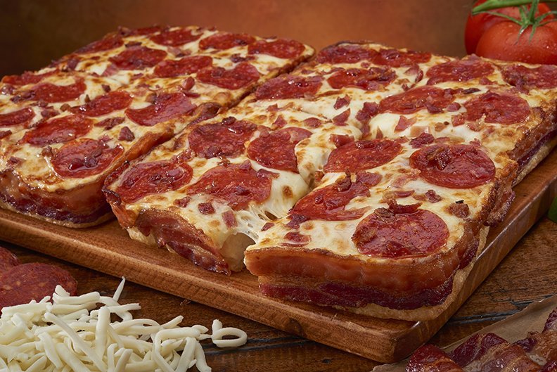 Little Caesars announced a new bacon-wrapped pizza on Wednesday, Feb. 18, 2015. The chain's Bacon Wrapped Crust Deep! Deep! Dish Pizza will be available nationwide Monday.