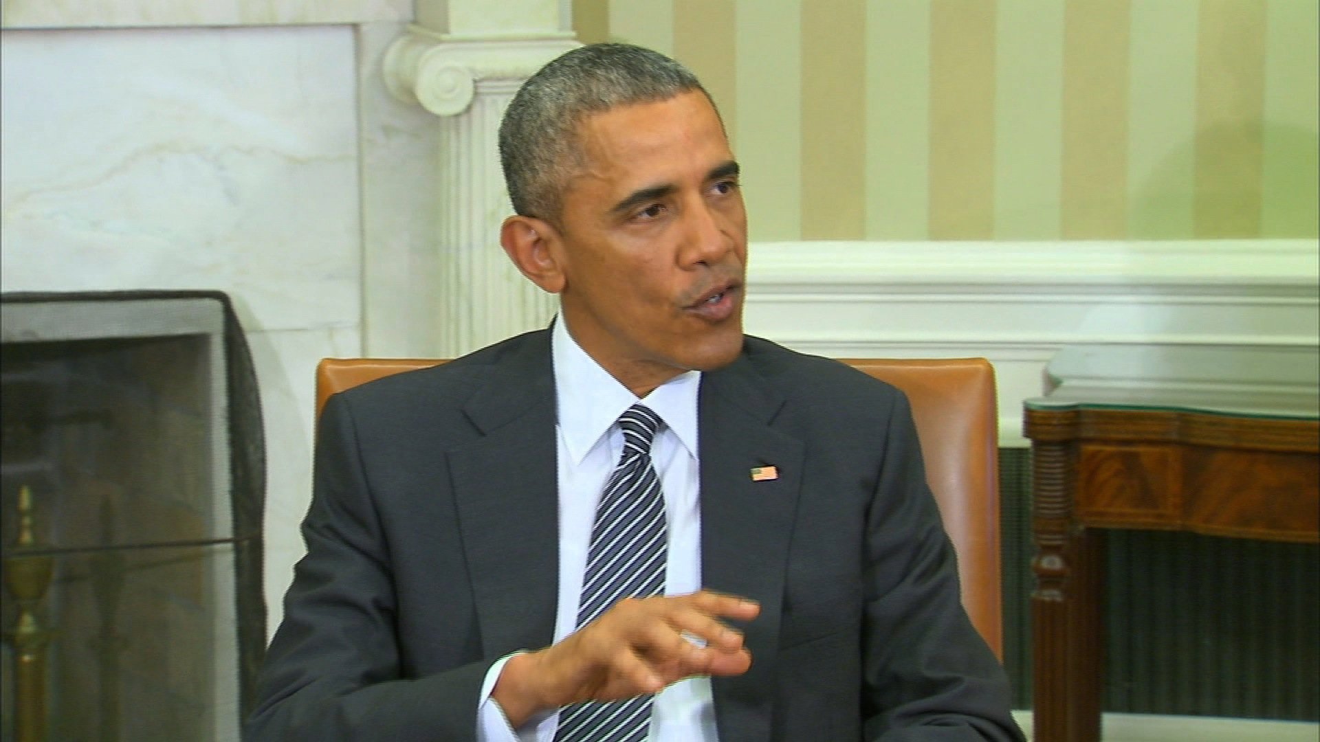 President Obama speaks in the Oval Office.