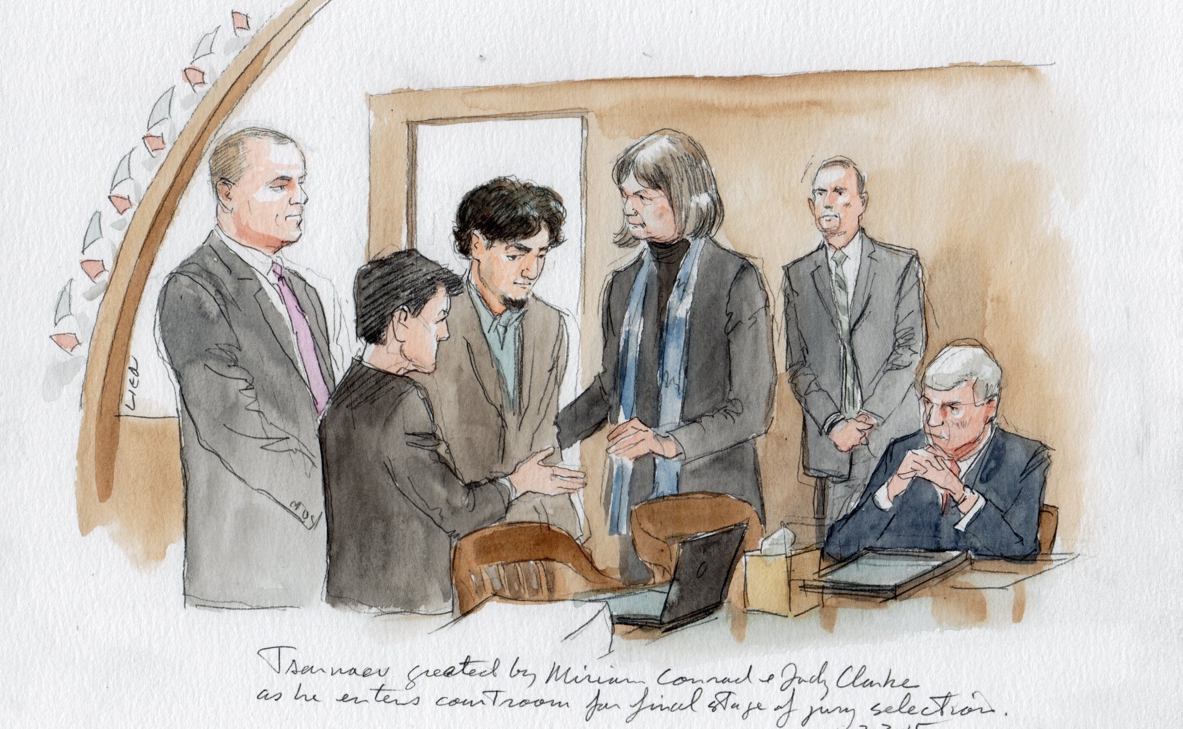 Tsarnaev and lawyers stand before pool of qualified jurors before seating jury. L to R : Weinreb, Pellegrini, Conrad, Tsarnaev, Clarke, Bruck, and seated US Marshals.