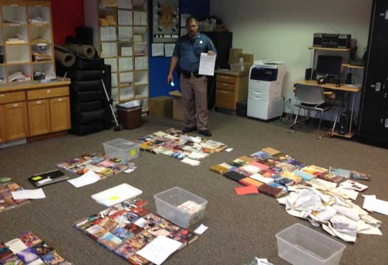 Colorado State Trooper Wilder with books cleaned up from Highway 287 in Boulder County