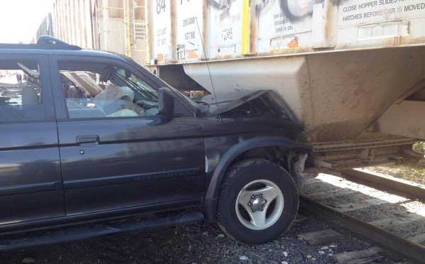 SUV hit 2 vehicles before crashing into train at 53rd and Fox in Adams County, Colo. Photo credit: Colorado State Patrol