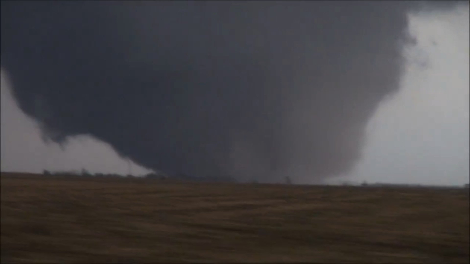 A large, wedge-shaped tornado, was captured on video by storm chasers near Rochelle, Illinois on April 9, 2015. Photo: @Basehunters via CNN