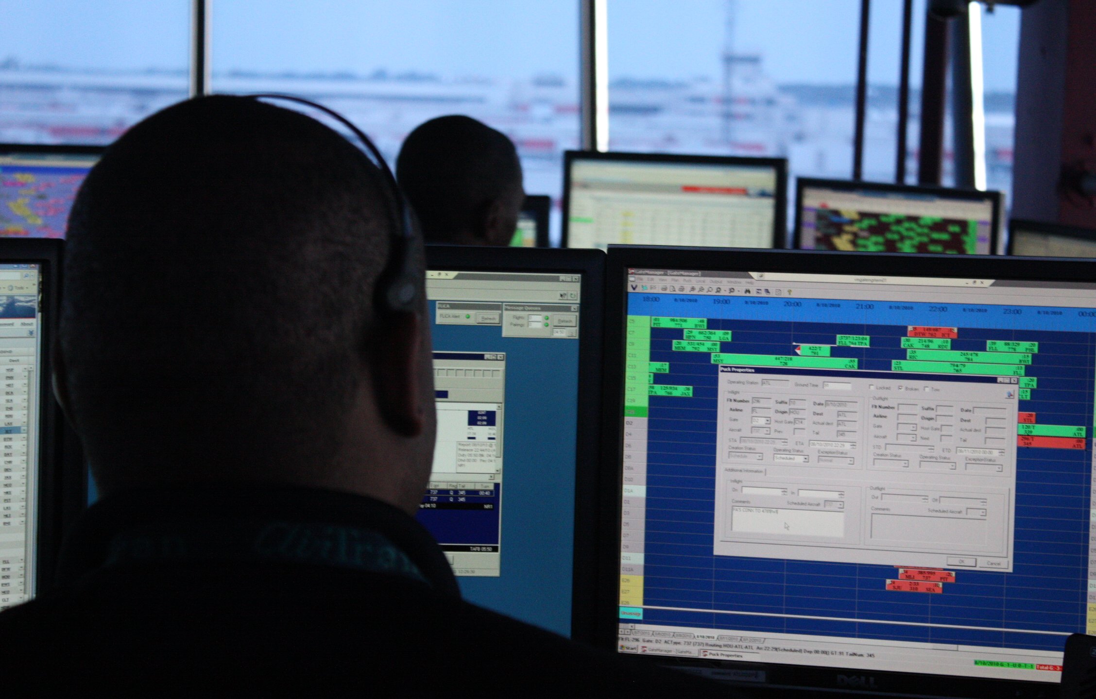 [FILE] An air traffic controller sits behind a computer screen at the Hartsfield-Jackson Atlanta International Airport. Photo credit: Kellie Keesee/CNN