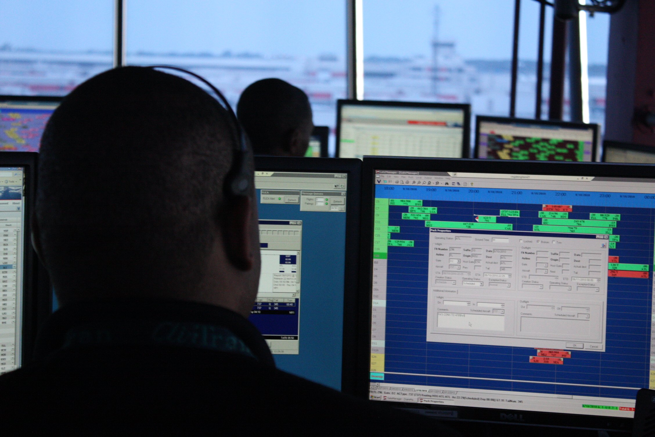 [FILE] An air traffic controller sits behind a computer screen at the Hartsfield-Jackson Atlanta International Airport. Photo credit: Kellie Keesee/CNN