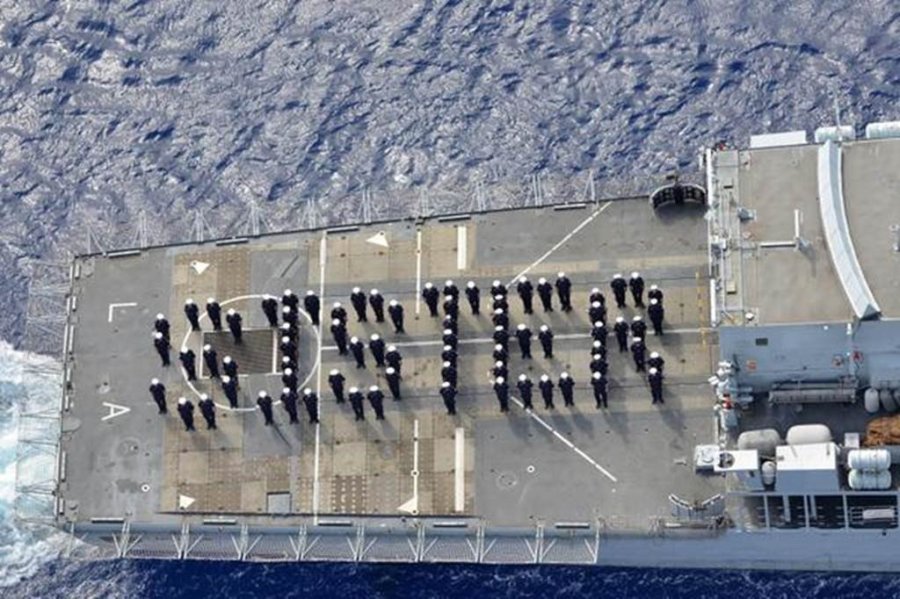 The crew of the Royal Navy's HMS Lancaster gathered to spell out "Sister" on the deck of their ship, after the announcement that a royal baby girl was delivered.