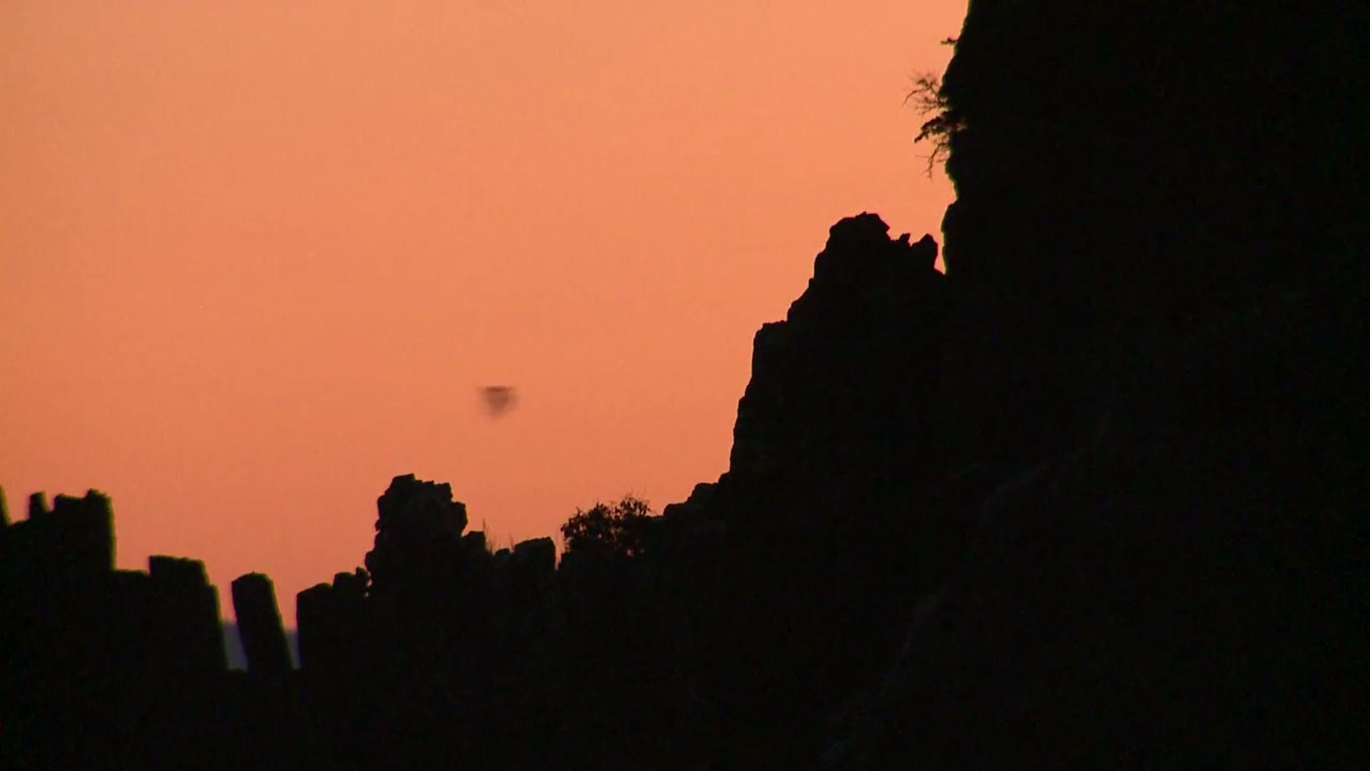 Sunset over the Orient Mine where the black specs in the sky are bats flying over the horizon. (Photo: Anne Herbst)