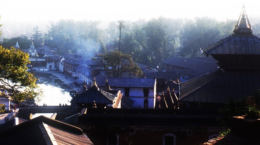 The fate of the Pashupatinath Temple complex near Kathmandu's international airport was not immediately known. This view in 1999 shows Pashupatinath's multiple pagodas, shrines, and public funeral pyres emitting smoke where many of the valley's human corpses are routinely cremated before the ashes are dumped into the narrow river. (Photo: CNN)