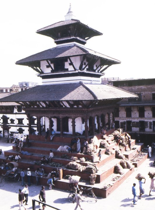 Kathmandu's losses included the completely demolished Narayan Temple pagoda, which was next to the devastated Shiva pagoda: both dominated Kathmandu's main Durbar Square. The Narayan temple, seen here in December 1995, was popular among traders who displayed food and household goods. Behind it, to the left, is the whitewashed entrance of the Virgin Goddess's dwelling place. (Photo: CNN)