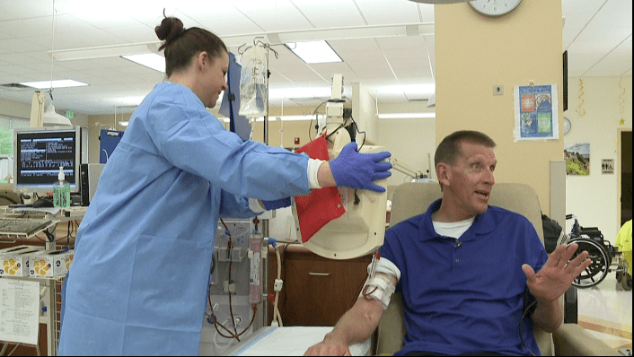 Cmdr. Scott Wegscheider receiving dialysis treatment at hospital.