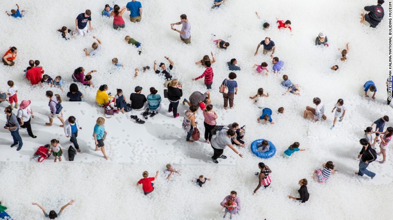 Nearly 1 million plastic balls simulate the surf in the National Building Museum. (Photo: Noah Kalina/National Building Museum)