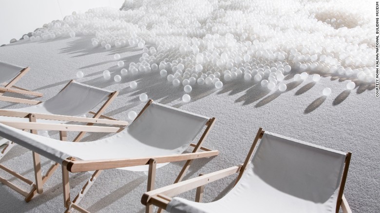 The 10,000-square-foot, stark-white installation includes lounge chairs and a concession stand. (Photo: Noah Kalina/National Building Museum)