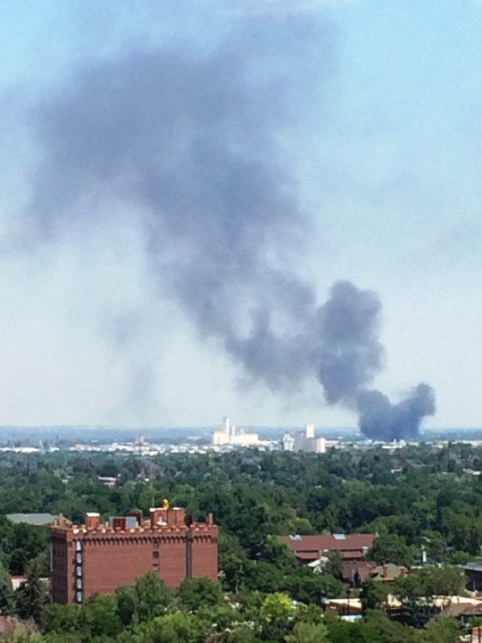 Smoke plume fills sky from warehouse fire in Commerce City. (Photo: Arash