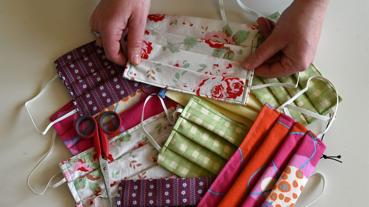 Several self-sewn face masks by Dirndl tailor Babs Wuertz are seen in her workshop in the Bavarian village of Essenbach, southern Germany, on April 3, 2020.