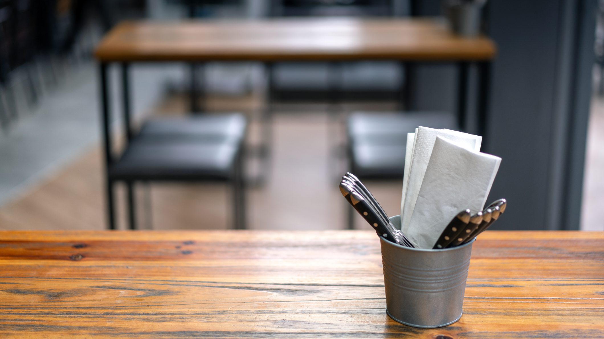 Tableware sits on a restaurant table in this file photo.