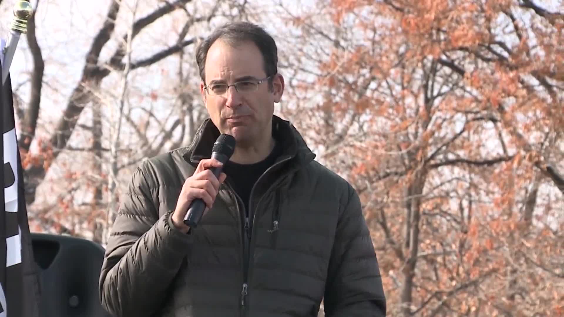 Colorado AG Phil Weiser speaks at "Remove Trump Now" rally