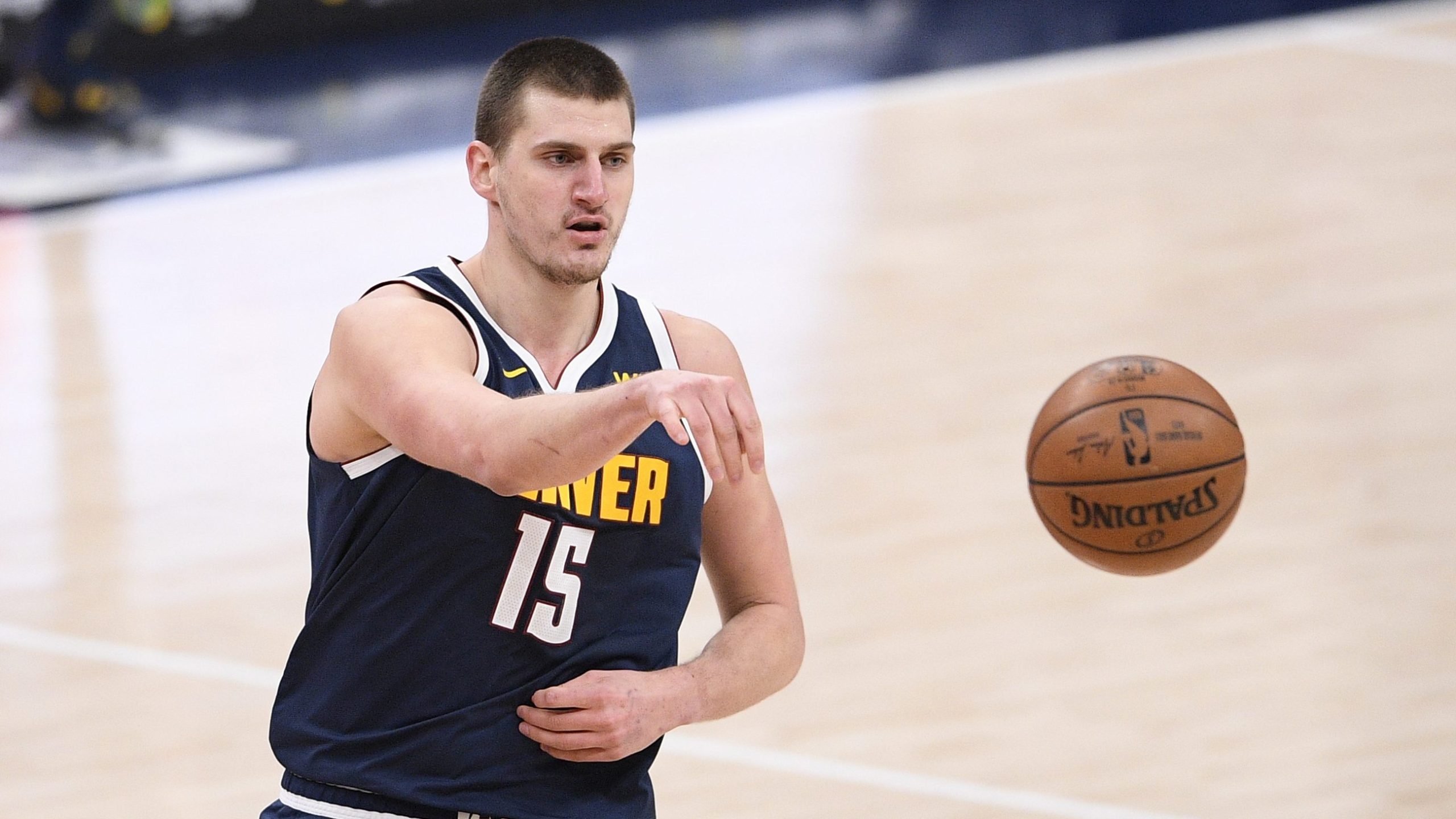 Denver Nuggets center Nikola Jokic passes during the second half of an NBA basketball game against the Washington Wizards, Wednesday, Feb. 17, 2021, in Washington.