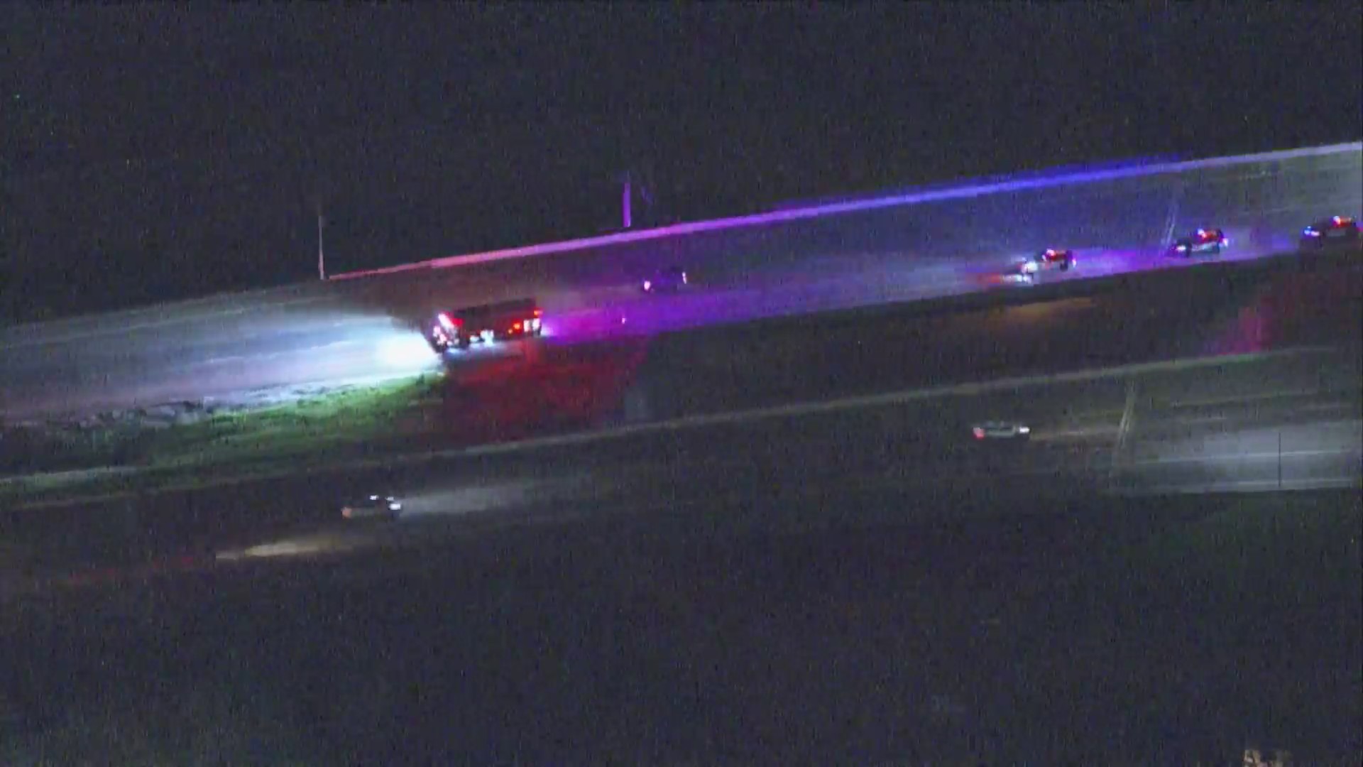 Aerial view at night of emergency vehicles on Interstate