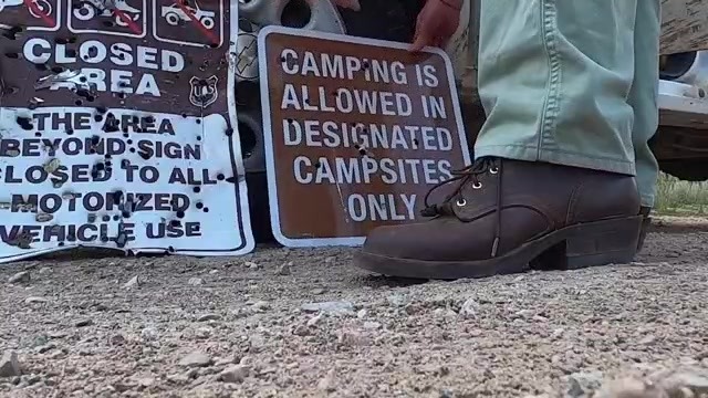 Campsite signage destroyed by bullet holes