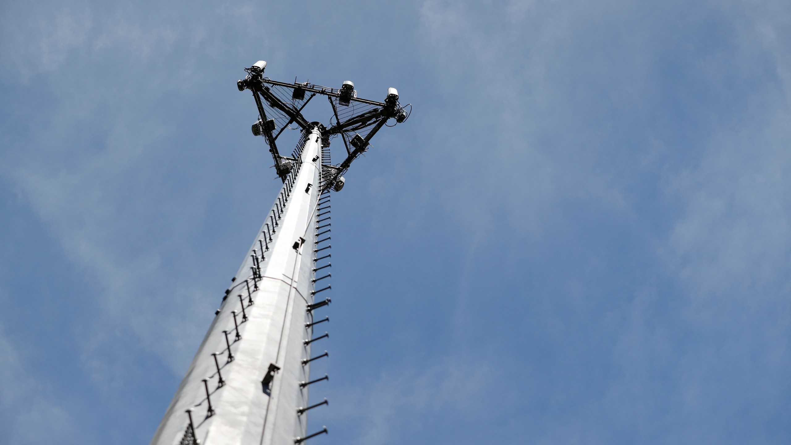 Looking up at a cellular phone tower